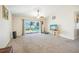 Bright living room with sliding doors leading to a backyard pool at 106 Haversham Way, Davenport, FL 33897