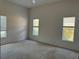 Bright bedroom with carpeted floors and multiple windows at 2331 Salzburg Loop, Winter Haven, FL 33884