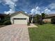 One-story home with a two-car garage and paved driveway at 2331 Salzburg Loop, Winter Haven, FL 33884