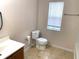 Simple bathroom with toilet, vanity, and bathtub at 963 N Jacks Lake Rd, Clermont, FL 34711