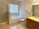 Bathroom with shower, bathtub, toilet and double vanity at 963 N Jacks Lake Rd, Clermont, FL 34711