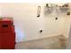 Laundry room with storage and concrete floor at 963 N Jacks Lake Rd, Clermont, FL 34711