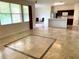 Open concept living room and kitchen with tile flooring at 963 N Jacks Lake Rd, Clermont, FL 34711