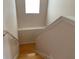 Wooden staircase with simple white railings at 963 N Jacks Lake Rd, Clermont, FL 34711