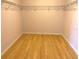Large walk-in closet with wire shelving and wood flooring at 963 N Jacks Lake Rd, Clermont, FL 34711
