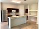Kitchen with island, stainless steel appliances and ample cabinetry at 963 N Jacks Lake Rd, Clermont, FL 34711
