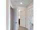 Bright hallway with doors to bedrooms and bathrooms at 14501 Grove Resort Ave # 3230, Winter Garden, FL 34787