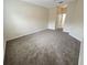 Spacious bedroom with carpet flooring and access to a bathroom at 4881 Cypress Woods Dr # 3213, Orlando, FL 32811