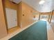 Interior hallway with carpet and access to unit at 4881 Cypress Woods Dr # 3213, Orlando, FL 32811