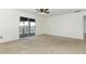 Bedroom with sliding glass doors and water view at 14126 Fox Glove St, Winter Garden, FL 34787