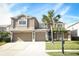 Two-story house with a large yard and two-car garage at 14126 Fox Glove St, Winter Garden, FL 34787