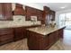 Spacious kitchen with granite countertops and dark wood cabinetry at 14126 Fox Glove St, Winter Garden, FL 34787