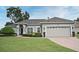 Beautiful house exterior with well-manicured lawn at 1322 Lucky Pennie Way, Apopka, FL 32712