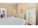 Main bedroom with dresser, large closet, and en-suite bathroom access at 1131 Singleton Cir, Groveland, FL 34736