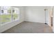 Bright bedroom with carpet flooring and large window at 1833 Ross Hammock Ave, Groveland, FL 34736