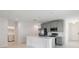 Modern kitchen with stainless steel appliances and an island at 1833 Ross Hammock Ave, Groveland, FL 34736