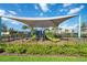 Community playground with shade structure, slides, and climbing equipment at 1833 Ross Hammock Ave, Groveland, FL 34736