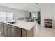 Open kitchen with island overlooking living room at 1833 Ross Hammock Ave, Groveland, FL 34736