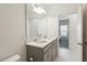 Double vanity bathroom with access to bedroom at 1833 Ross Hammock Ave, Groveland, FL 34736