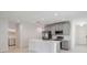 Modern kitchen with stainless steel appliances and an island at 1833 Ross Hammock Ave, Groveland, FL 34736