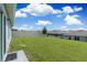 Spacious backyard with a grassy lawn, privacy fence, and a patio area at 162 Piave St, Haines City, FL 33844