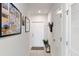 Bright hallway with coat rack and access to exterior and other rooms at 162 Piave St, Haines City, FL 33844