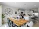 Modern kitchen with an island, white cabinets, and a farmhouse dining table at 162 Piave St, Haines City, FL 33844
