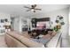 Comfortable living room boasting a large sectional sofa and TV at 162 Piave St, Haines City, FL 33844