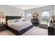 Spacious main bedroom with a king-size bed and ample natural light at 162 Piave St, Haines City, FL 33844