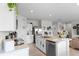 Modern kitchen with stainless steel appliances and white cabinetry at 162 Piave St, Haines City, FL 33844
