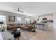 Open living area with L-shaped sectional sofa, modern coffee table, and kitchen views at 162 Piave St, Haines City, FL 33844