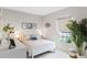 Bright bedroom with a queen-sized bed and window coverings at 162 Piave St, Haines City, FL 33844