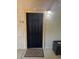 Black front door with a patterned doormat, outside a building at , Lake Mary, FL 32746