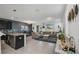 Open living space with kitchen island view, comfortable seating and large windows at 15259 Willow Arbor Cir, Orlando, FL 32824