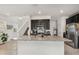 Modern kitchen with granite island, stainless steel appliances, and dark cabinets at 15259 Willow Arbor Cir, Orlando, FL 32824