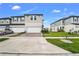 Two-story house with two-car garage and well-maintained lawn at 15259 Willow Arbor Cir, Orlando, FL 32824