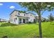 Landscaped backyard with patio and lush green grass at 15259 Willow Arbor Cir, Orlando, FL 32824