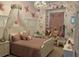 Charming bedroom with floral wall paper and window seat at 8208 Vineland Oaks Blvd, Orlando, FL 32835