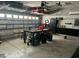 Organized garage with overhead storage and workbench at 8208 Vineland Oaks Blvd, Orlando, FL 32835