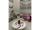 Play room with -sized table and play kitchen at 8208 Vineland Oaks Blvd, Orlando, FL 32835