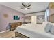 King-size bed, large TV, and plenty of closet space at 2210 Lelani Cir, Davenport, FL 33897