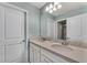 Double vanity bathroom with neutral colors and plenty of counter space at 2210 Lelani Cir, Davenport, FL 33897