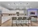 Modern kitchen with white cabinets, island, and stainless steel appliances at 2210 Lelani Cir, Davenport, FL 33897