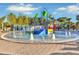 Community splash pad with colorful play features and ample seating at 2210 Lelani Cir, Davenport, FL 33897