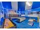 Star Wars themed game room with shuffleboard, pinball, and seating at 2210 Lelani Cir, Davenport, FL 33897