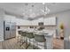 Modern kitchen with white cabinets, breakfast bar and stainless steel appliances at 2210 Lelani Cir, Davenport, FL 33897