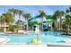 Relaxing pool area with waterslide and lush landscaping at 2210 Lelani Cir, Davenport, FL 33897
