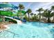 Resort-style pool with waterslides and lush landscaping at 2210 Lelani Cir, Davenport, FL 33897