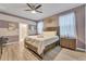 Spacious bedroom with a king-size bed, en-suite bathroom access, and large windows at 2210 Lelani Cir, Davenport, FL 33897