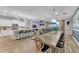 Open concept kitchen with white cabinets, island, and stainless steel appliances at 2210 Lelani Cir, Davenport, FL 33897